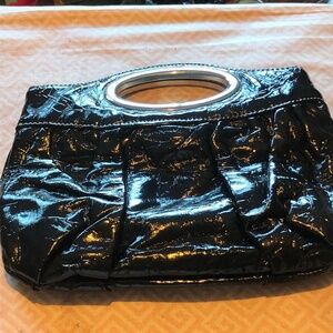 Nice looking clutch with metal handle and snap inside,  real clean, like new